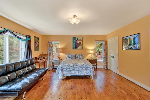 bedroom with light hardwood / wood-style floors