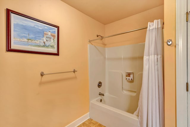 bathroom with shower / bath combination with curtain