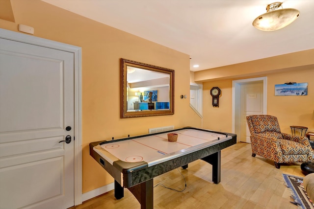 recreation room featuring wood-type flooring