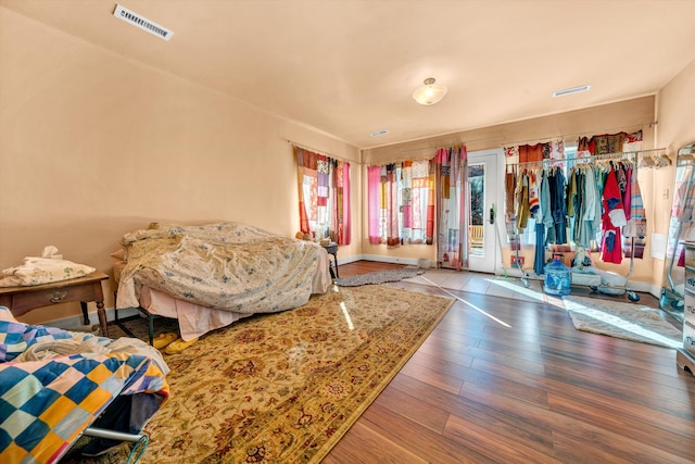 bedroom with hardwood / wood-style floors