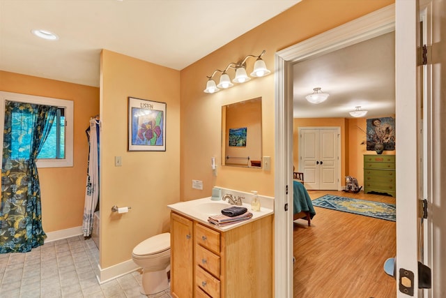 bathroom with a shower with shower curtain, vanity, wood-type flooring, and toilet