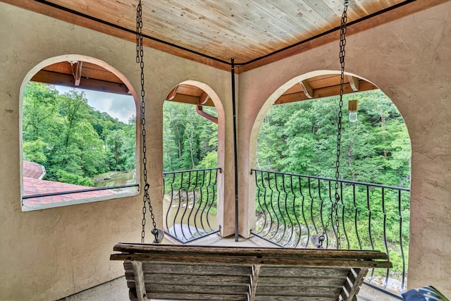 view of patio featuring a balcony