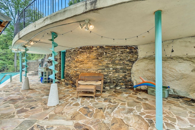 view of patio / terrace with a fireplace and a balcony