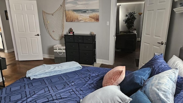 bedroom with dark wood-type flooring