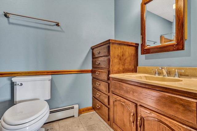 bathroom with tile patterned flooring, vanity, a baseboard radiator, and toilet