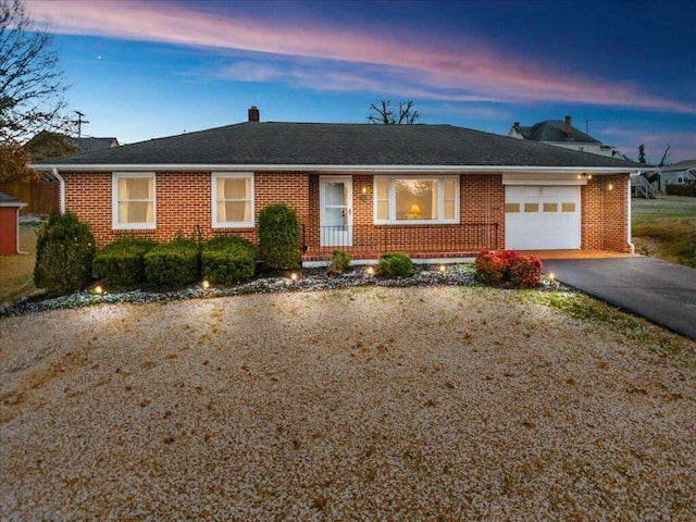 ranch-style house featuring a garage