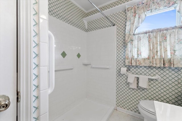 bathroom featuring tile patterned floors, toilet, tile walls, and a shower with shower curtain