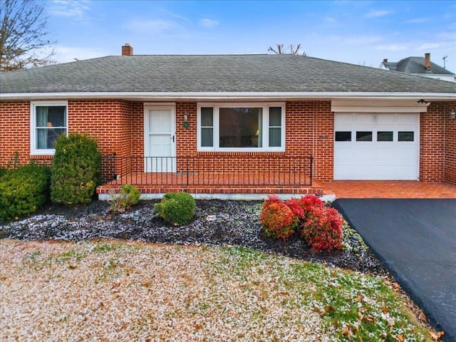 single story home featuring a garage