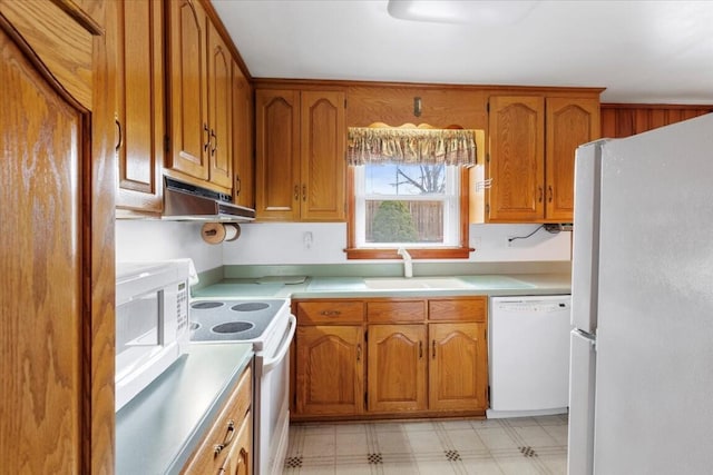 kitchen featuring sink and white appliances