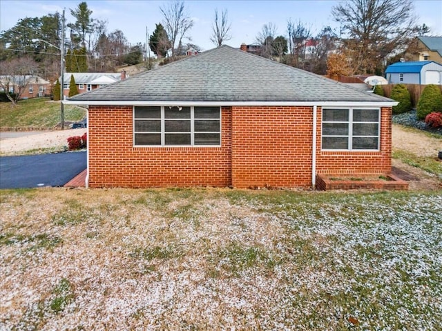 view of property exterior with a lawn