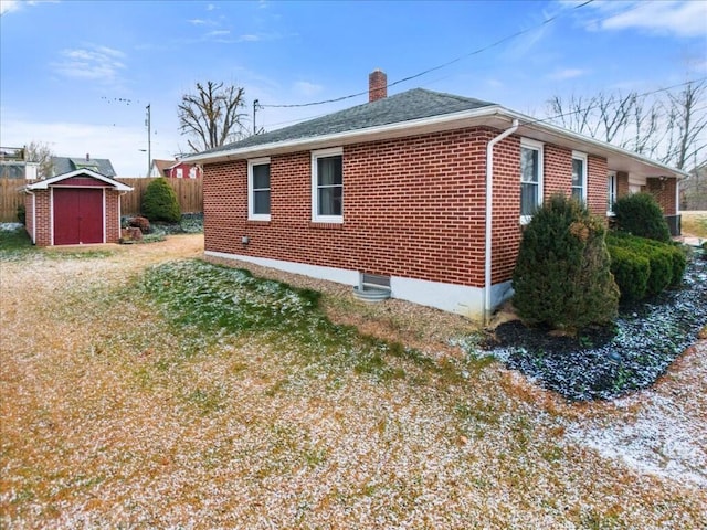 view of property exterior with a shed