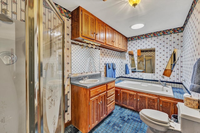 bathroom with tile patterned flooring, vanity, toilet, and a shower with door