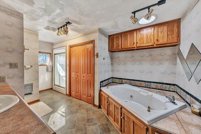 bathroom featuring a bath and vanity