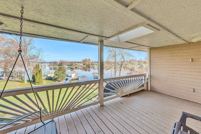 wooden deck featuring a water view