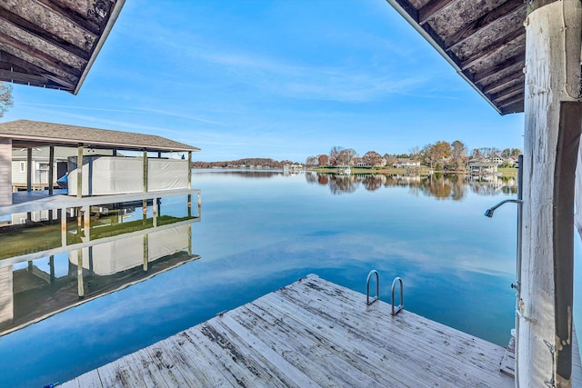 dock area with a water view