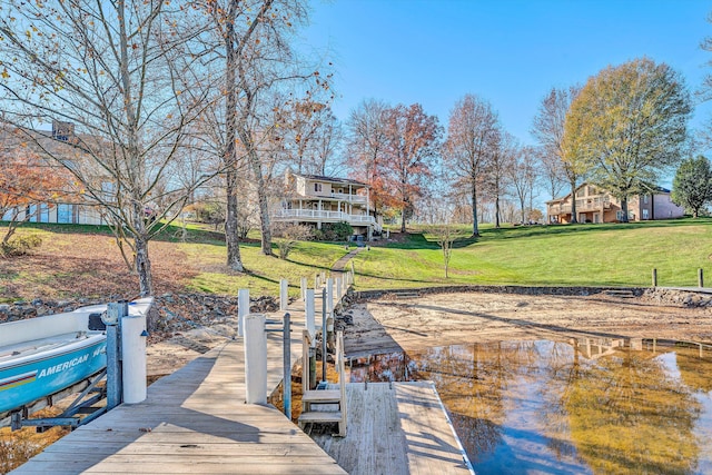 dock area featuring a lawn