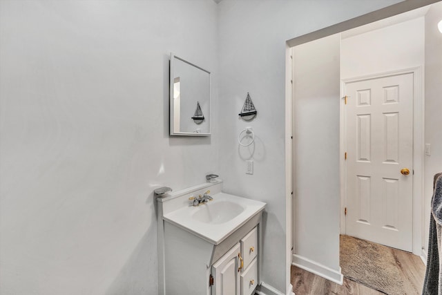 bathroom with vanity and hardwood / wood-style flooring