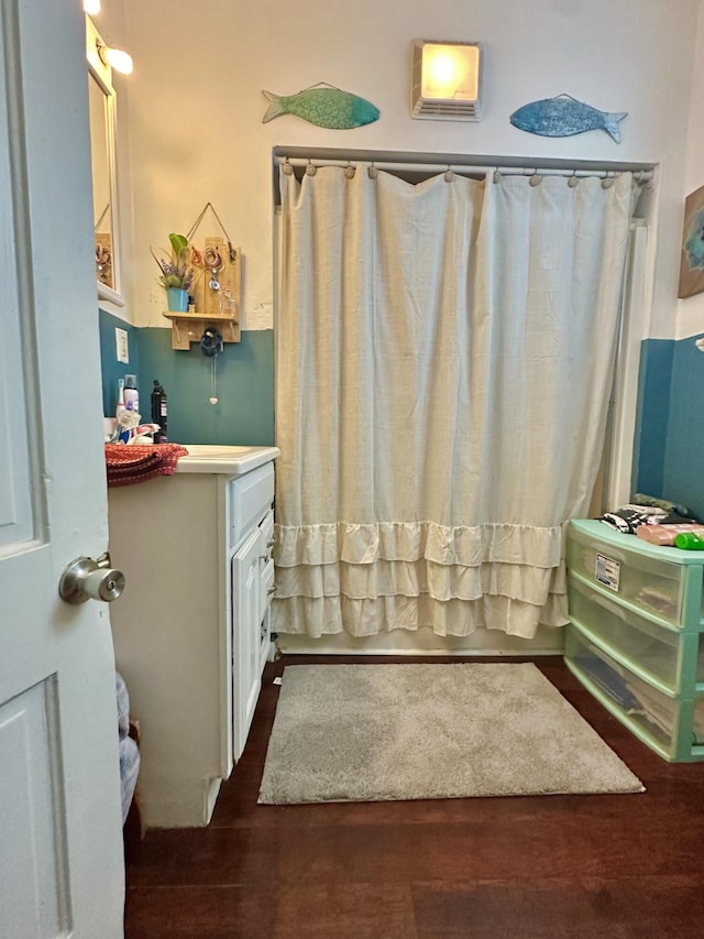 bathroom featuring wood-type flooring and vanity