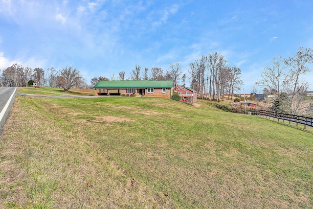 view of yard with a rural view