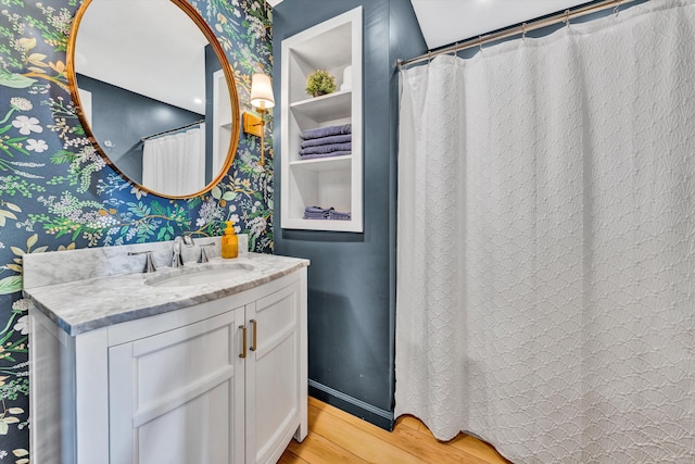 bathroom with vanity and hardwood / wood-style flooring