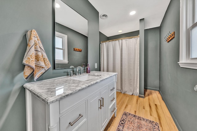 bathroom featuring vanity and wood-type flooring