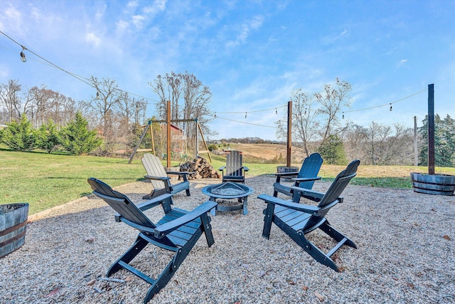 view of yard with a fire pit