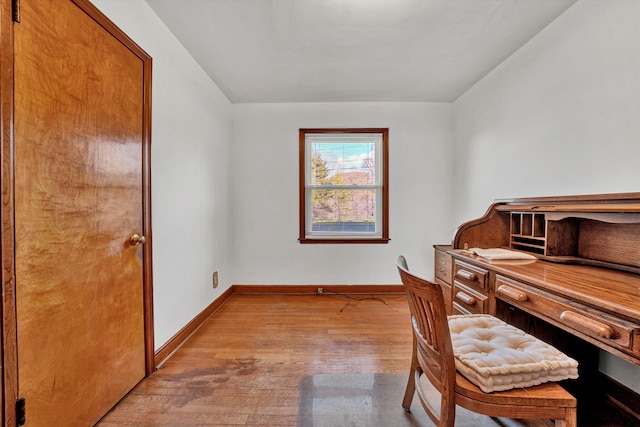 office with light hardwood / wood-style flooring