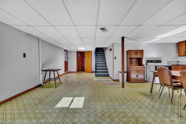 basement featuring a paneled ceiling