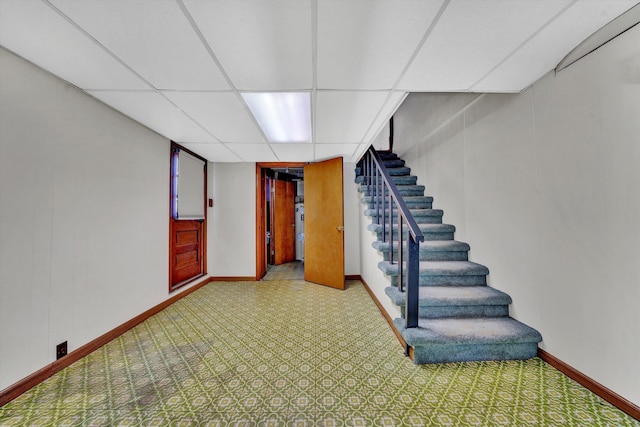 basement featuring a paneled ceiling