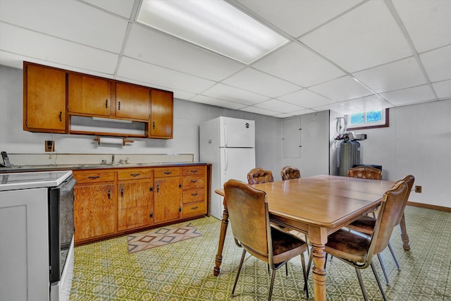 dining room featuring a paneled ceiling and sink