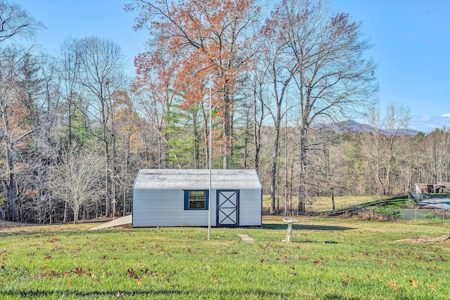 view of outdoor structure with a lawn