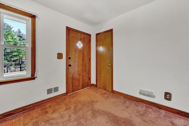 entryway featuring light carpet