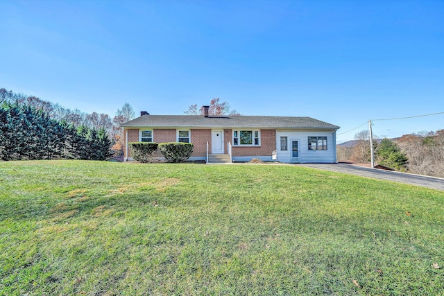 ranch-style house with a front lawn