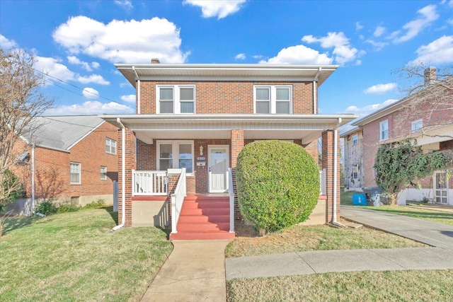 front facade with a porch and a front lawn