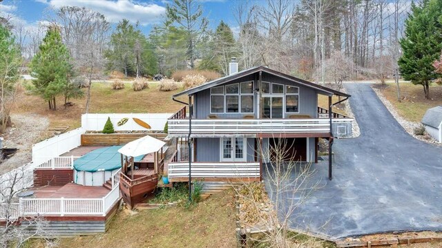 back of property featuring a garage