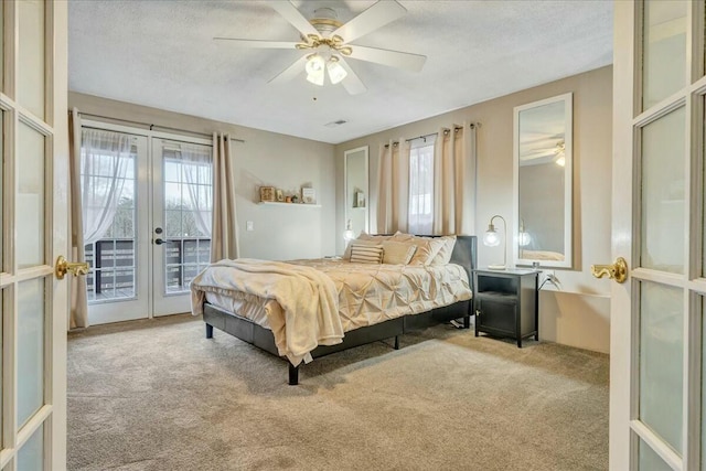 bedroom featuring light carpet, access to exterior, multiple windows, and french doors