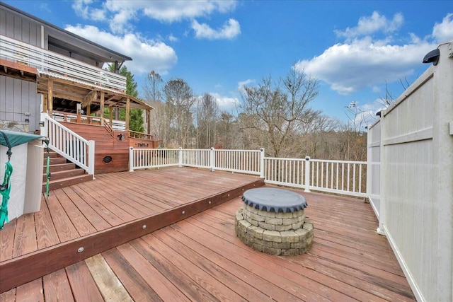 wooden deck featuring a fire pit