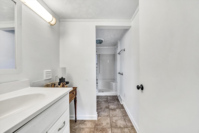 bathroom featuring walk in shower, tile patterned floors, crown molding, a textured ceiling, and vanity