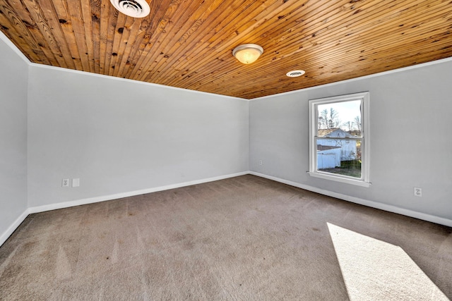 empty room featuring wooden ceiling and carpet floors