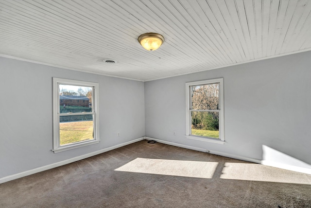 carpeted spare room with crown molding and wood ceiling