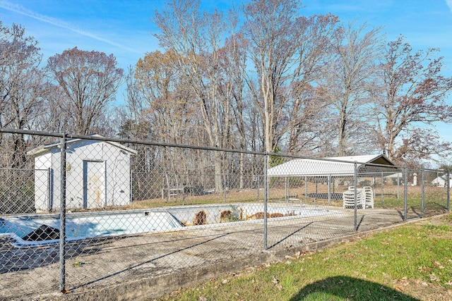 view of pool with a storage shed