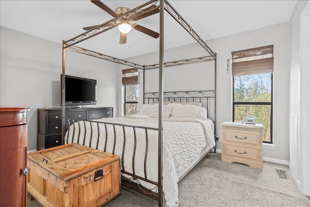 bedroom featuring ceiling fan and carpet