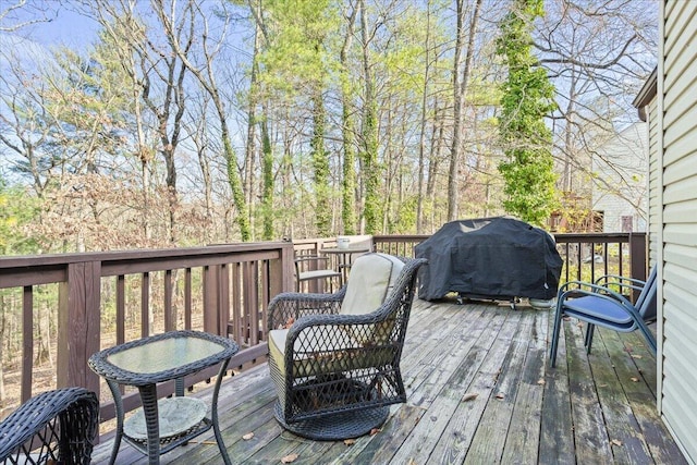 wooden terrace featuring grilling area