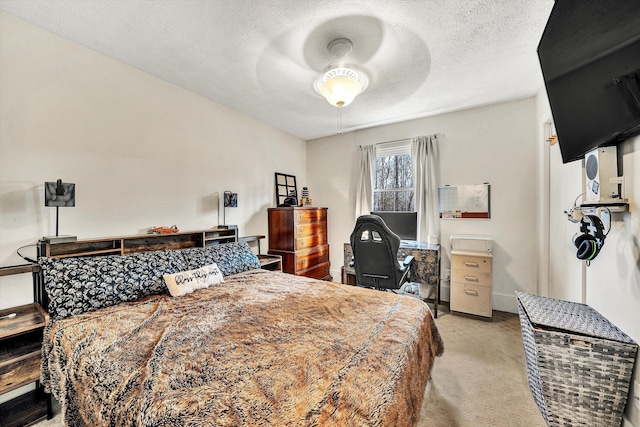 bedroom with light carpet, a textured ceiling, and ceiling fan