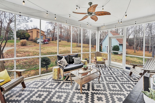 sunroom with a wealth of natural light and ceiling fan