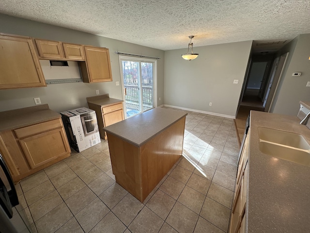 kitchen with sink, light tile patterned floors, white range oven, pendant lighting, and a kitchen island