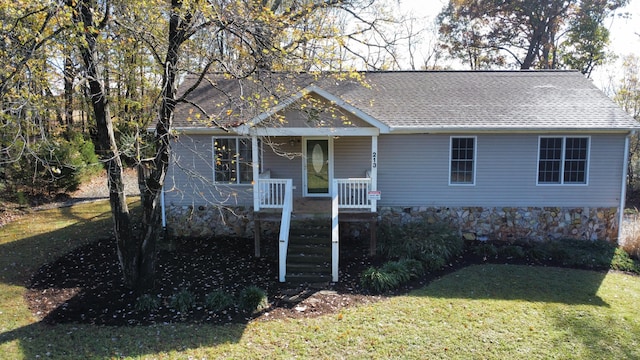 view of front of home featuring a porch and a front yard