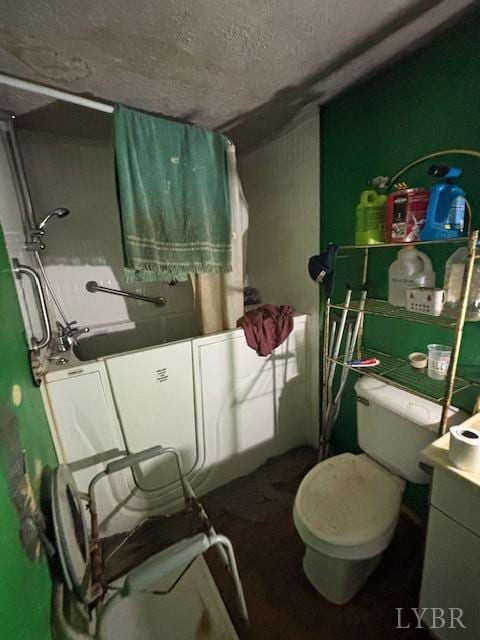 full bathroom with vanity,  shower combination, toilet, and a textured ceiling