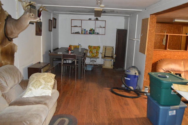 living room featuring dark wood-type flooring