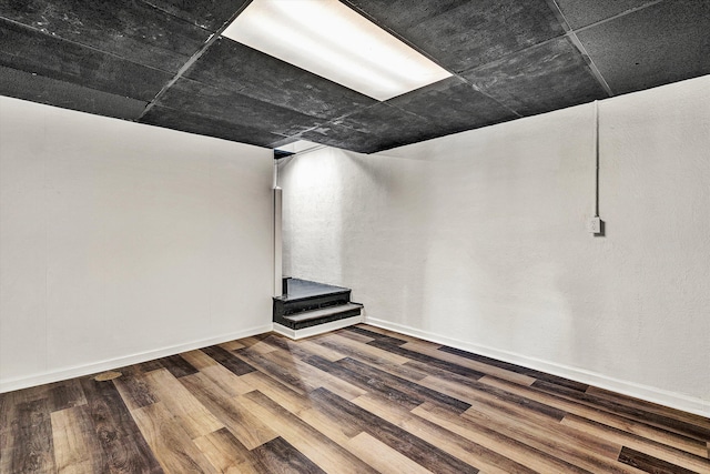 basement with wood-type flooring